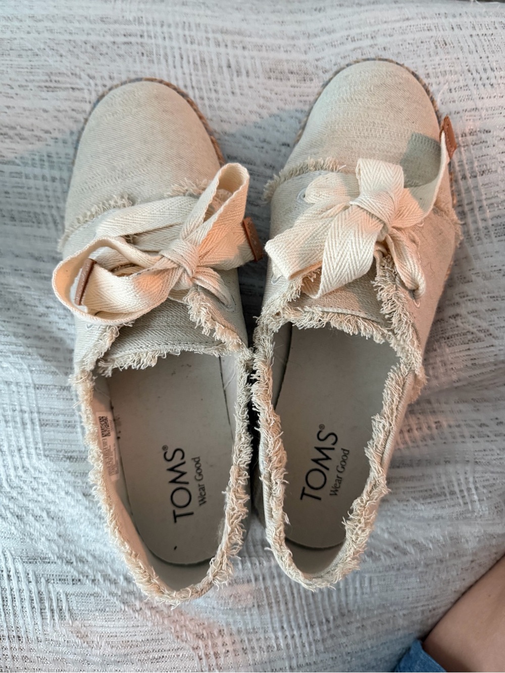TOMS Cream Canvas Slip-Ons with Bow Accent